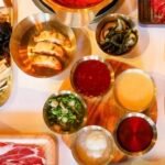 meats, seafood, vegetables, and sushi rolls.